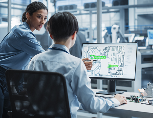 three workers in hard hats standing back to back