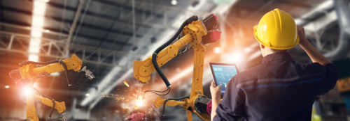 five aerospace mechanics in a line giving the camera a thumbs up