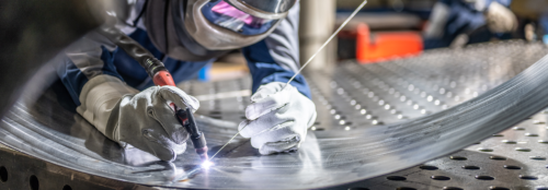 welder working on a steel plate